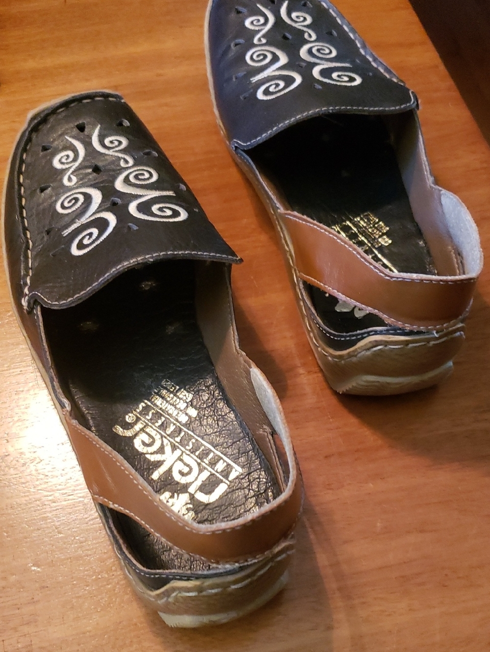 Rieker Black and Brown Women's Slip-On Flats with White Swirl Accents
